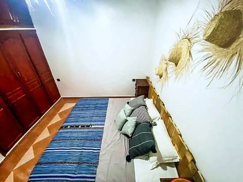 The same king room seen from above with wardrobe and rug